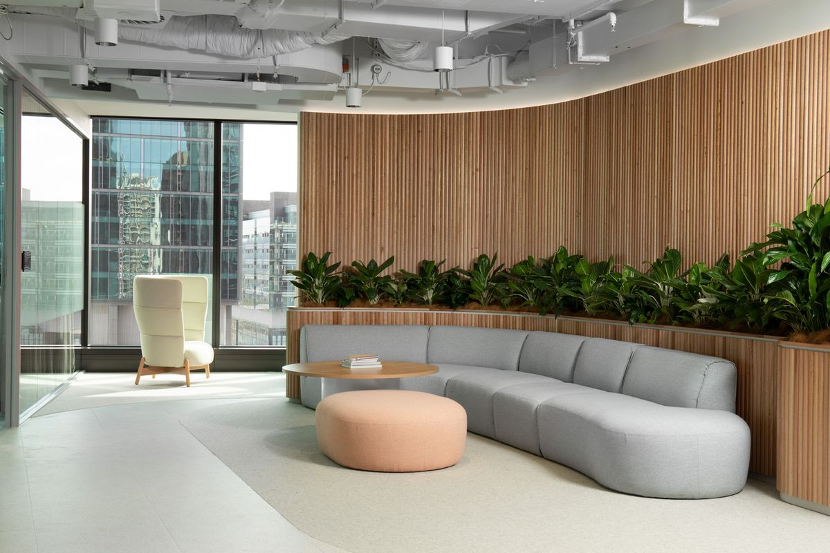 Room with a round table and a couch with commercial fit out